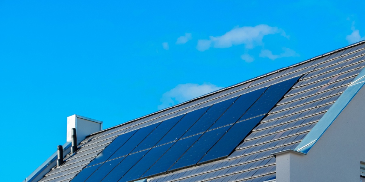 Solar panels on Malaysian rooftop with clear blue sky